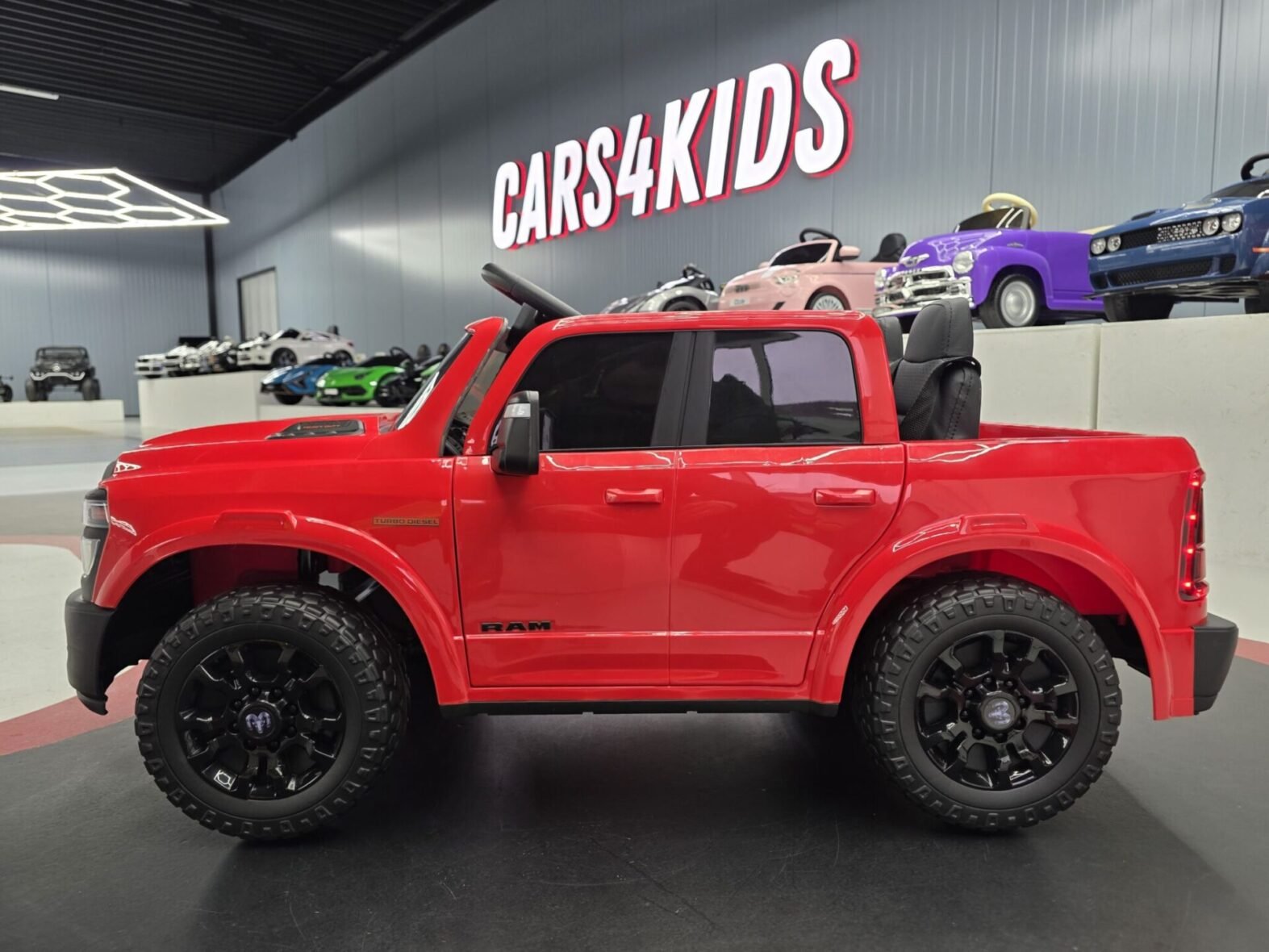 Kids electric Dodge RAM truck interior with leather seat and dashboard