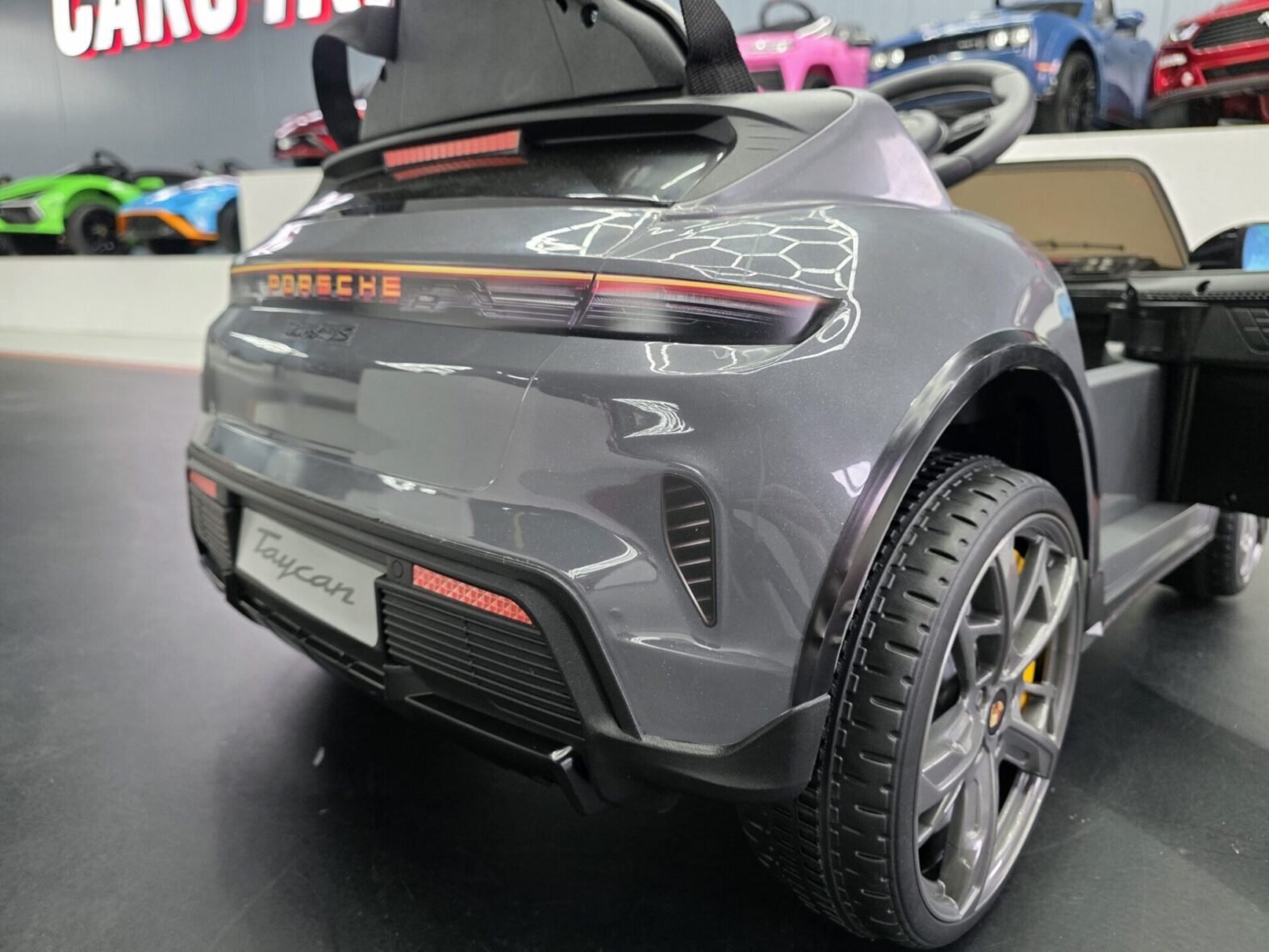 Porsche Taycan kids electric car rear view grey