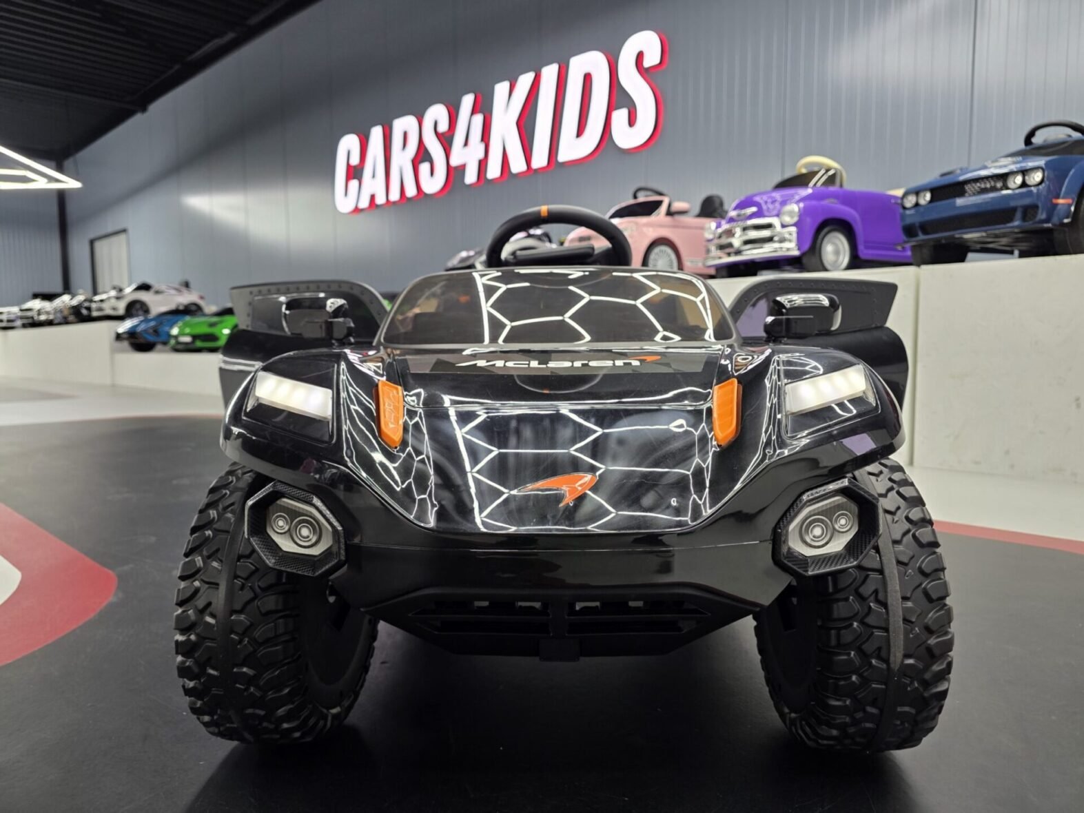 McLaren Rally children’s electric ride-on car side view showing EVA tyres