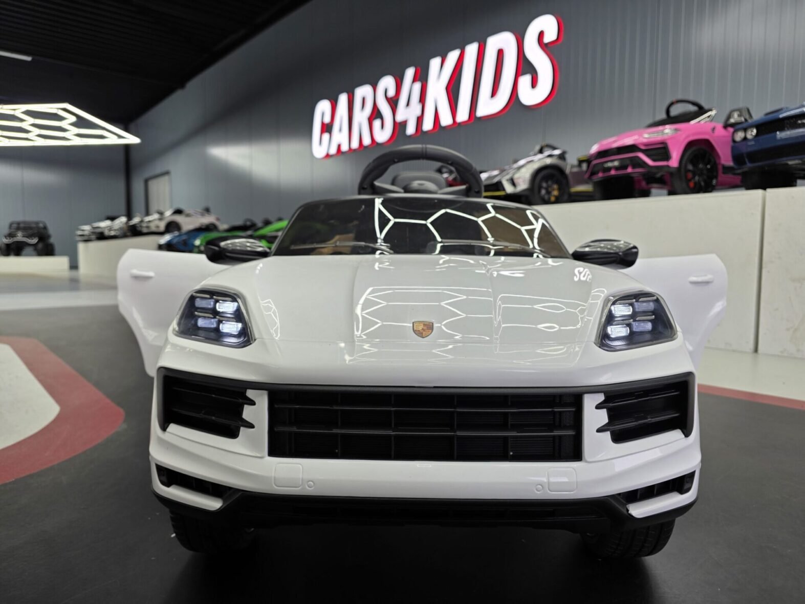 Porsche Cayenne white electric car for kids – side profile view