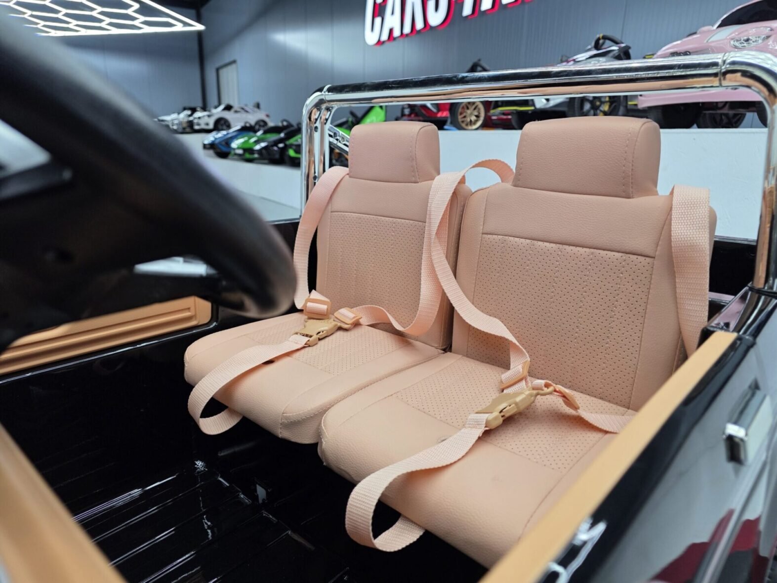 Metallic black Ford F-150 electric ride-on for kids rear view