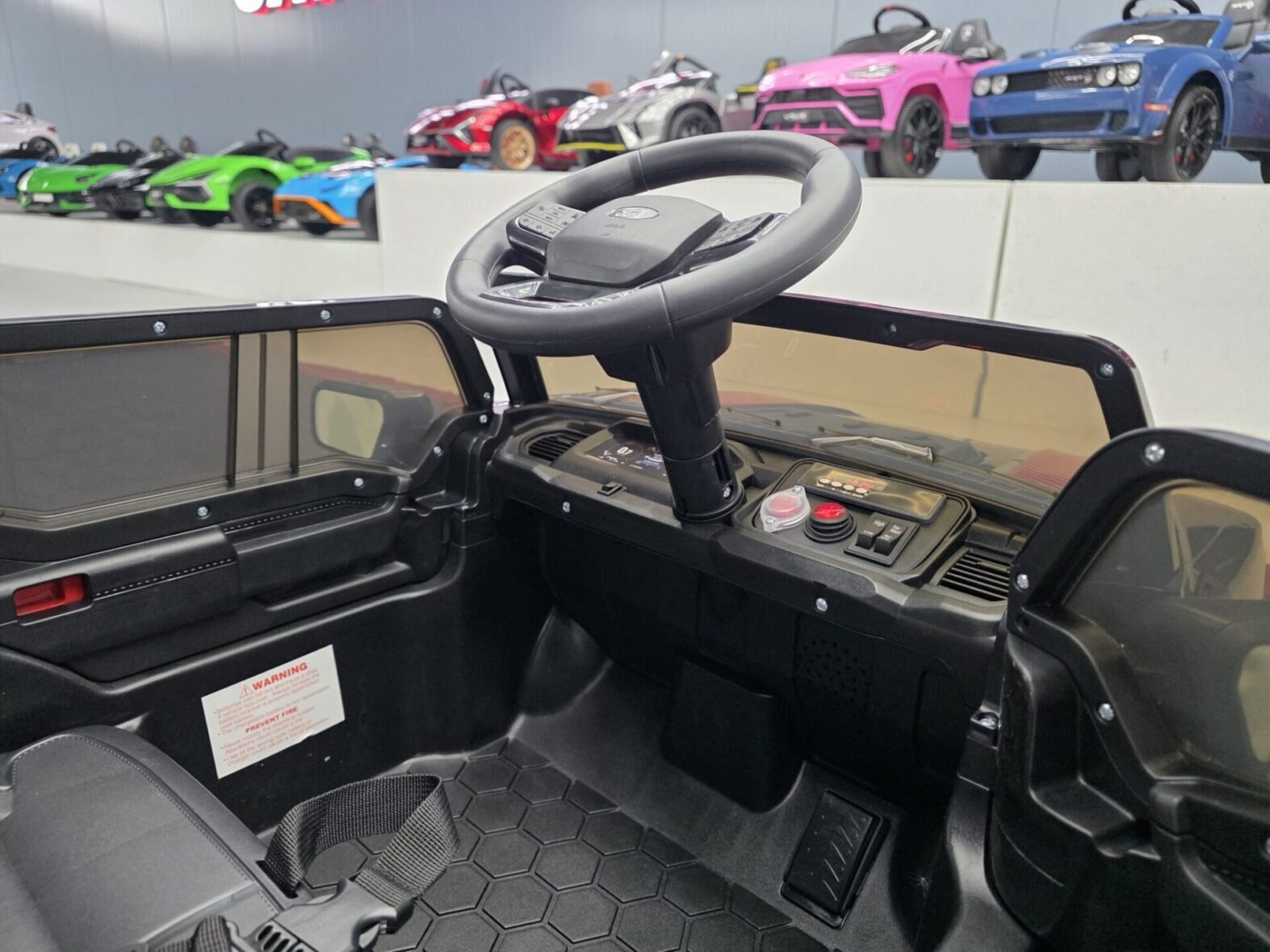 Ford Raptor electric ride-on vehicle wheel and suspension detail