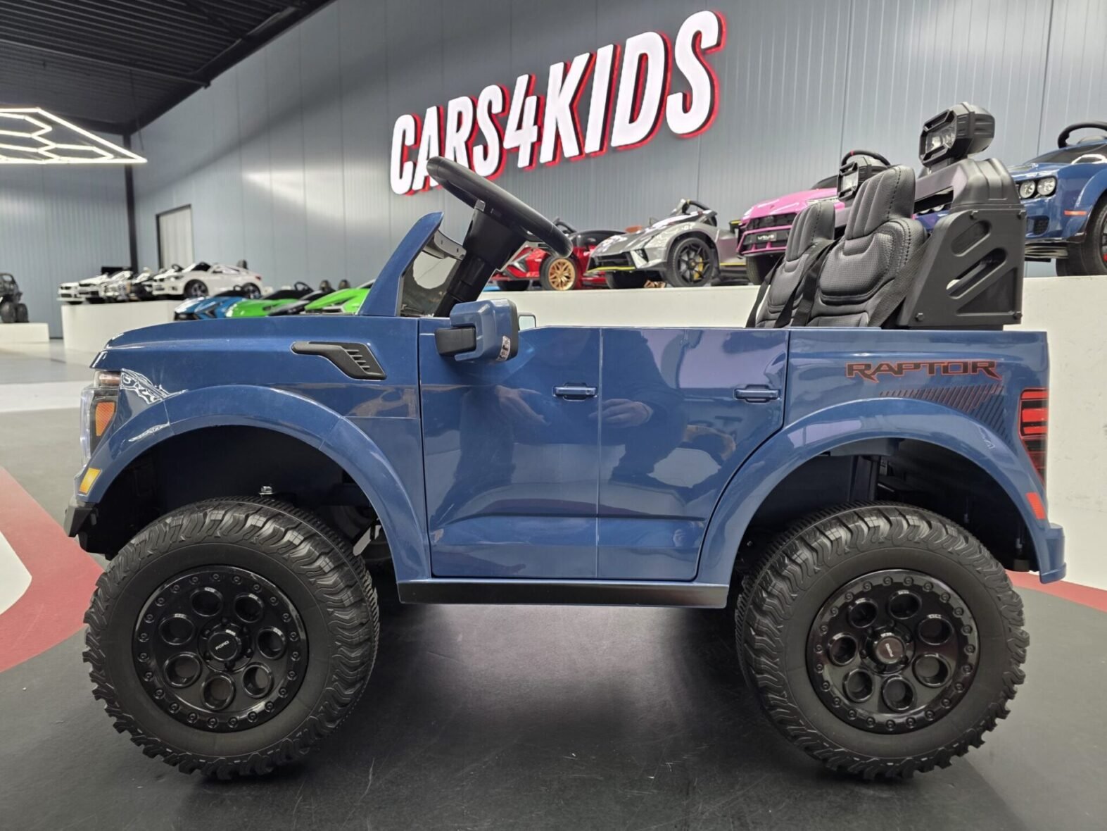 Ford Raptor 2-seater electric ride-on interior with leather seats and dashboard