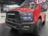 Child driving Dodge RAM 12V electric ride-on truck outdoors