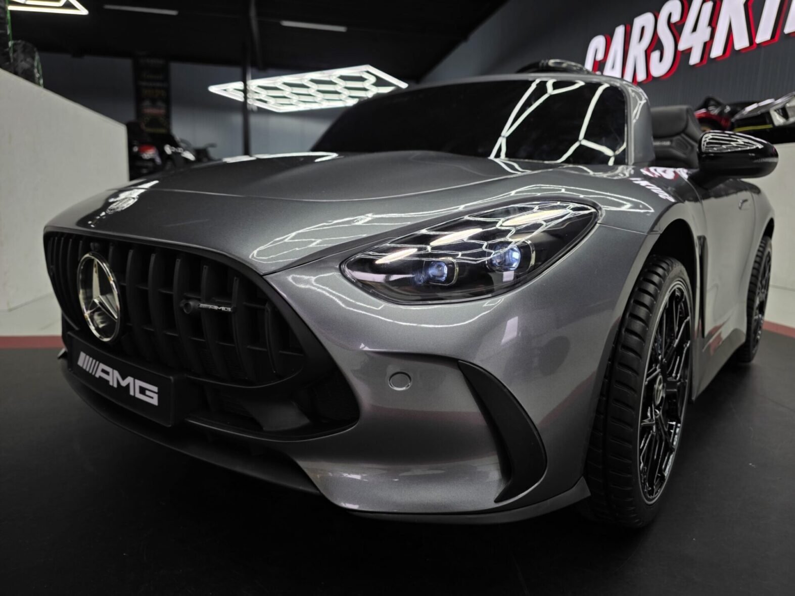 Side view of metallic grey Mercedes GT63 2-seater ride-on car