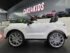 Porsche Cayenne kids ride-on car interior showing leather seat and dashboard