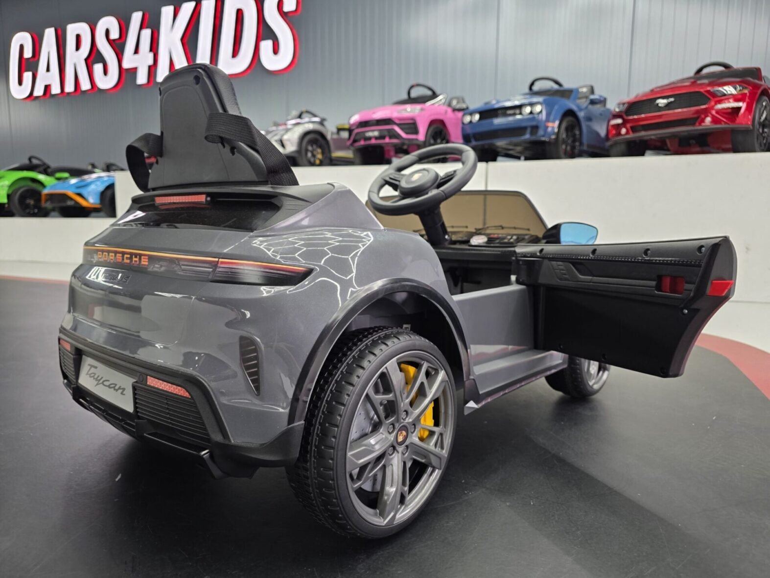 Interior dashboard of Porsche Taycan children’s electric car