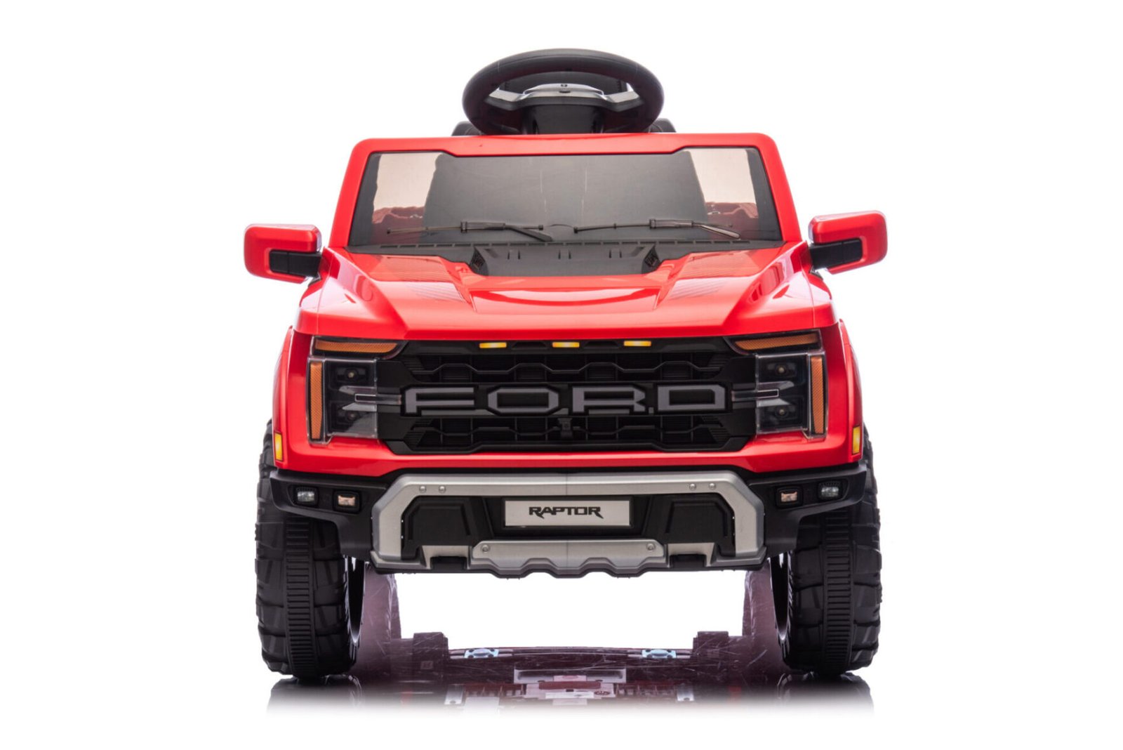 Red Ford Raptor electric car for kids showing dashboard and steering wheel