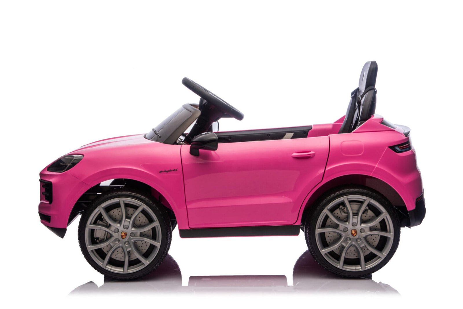 Pink Porsche Cayenne ride-on car interior with leather seat and dashboard
