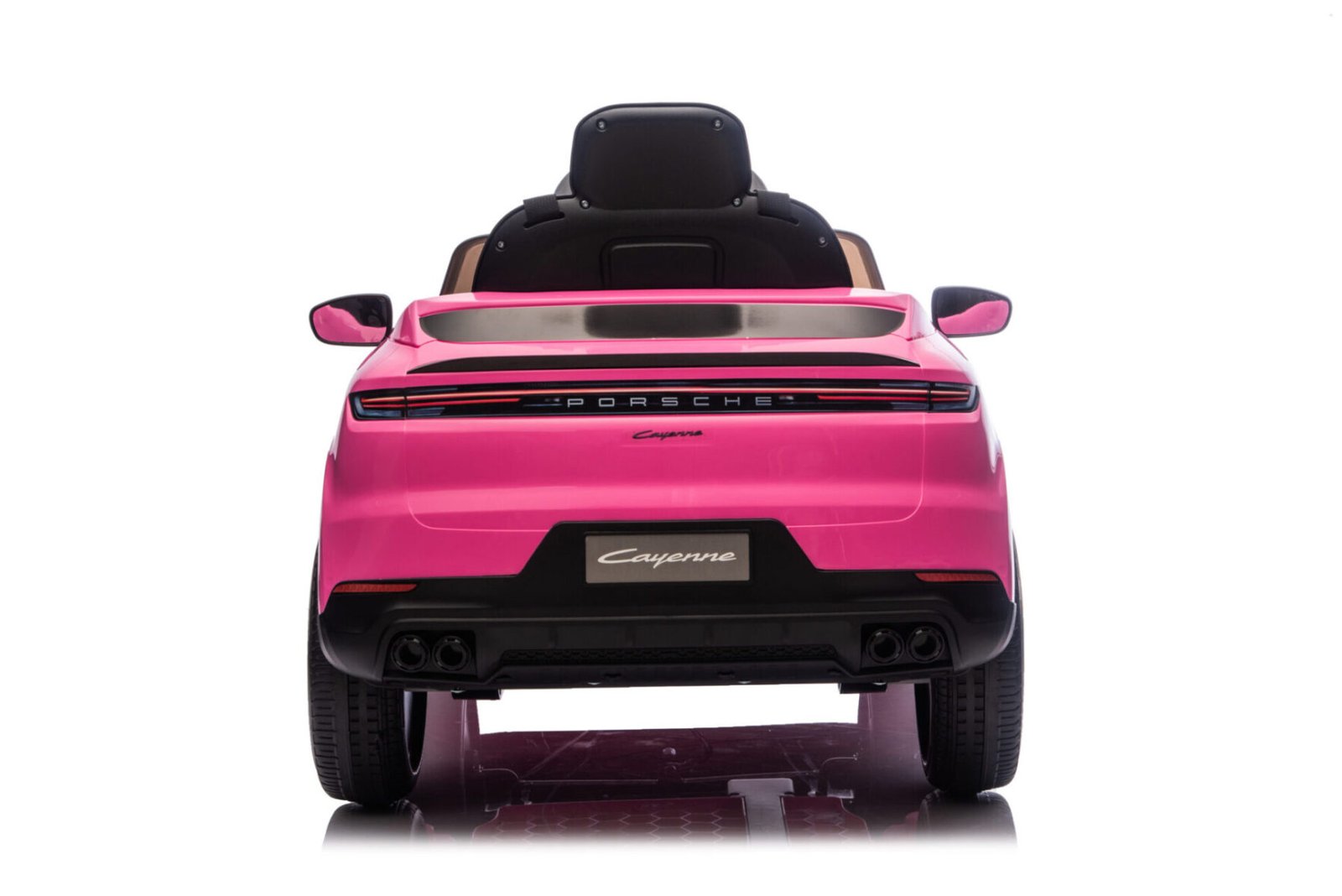 Child driving pink Porsche Cayenne 12V electric ride-on car
