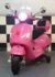 Vespa GTS kids electric scooter in pink with windshield and trunk